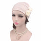 Light pink chemo cap with side fabric rose flower and pearl necklace accessory