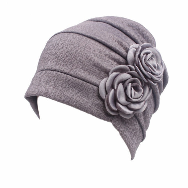 Medium gray chemo cap with pleated crown and large fabric rosette flower