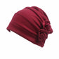 Wine red flower knit pull-over cap with pleated headband and rosette flower detail