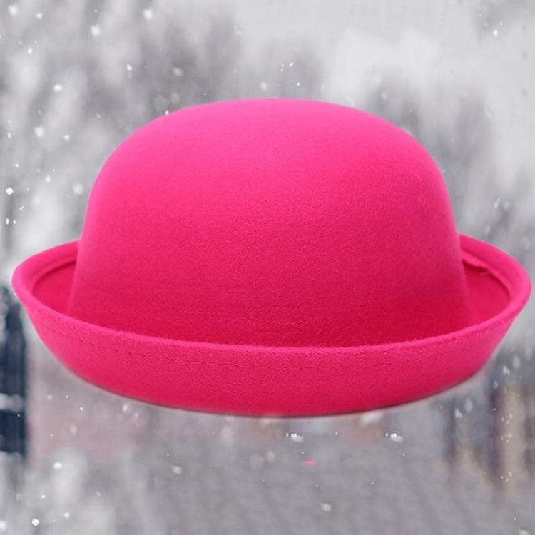 Pink felt dome hat with rolled brim, close-up of crown and band