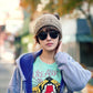Knit wool earmuff headband worn on head, textured cable knit design