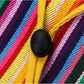 Striped yellow hat band detail with black oval button