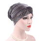Gray pleuche turban hat with rhinestone trim and square pattern across front