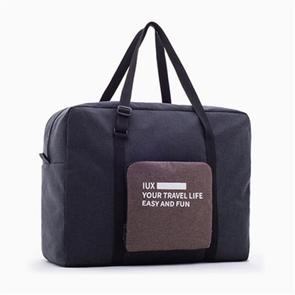 Foldable large travel duffel bag with top handles and front pocket, dark blue fabric.