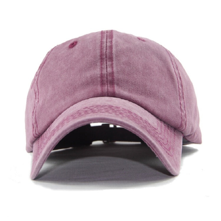 Pink washed cotton baseball cap with curved brim and stitched front panels