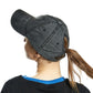 Dark gray washed cotton baseball cap worn by woman, side and back view