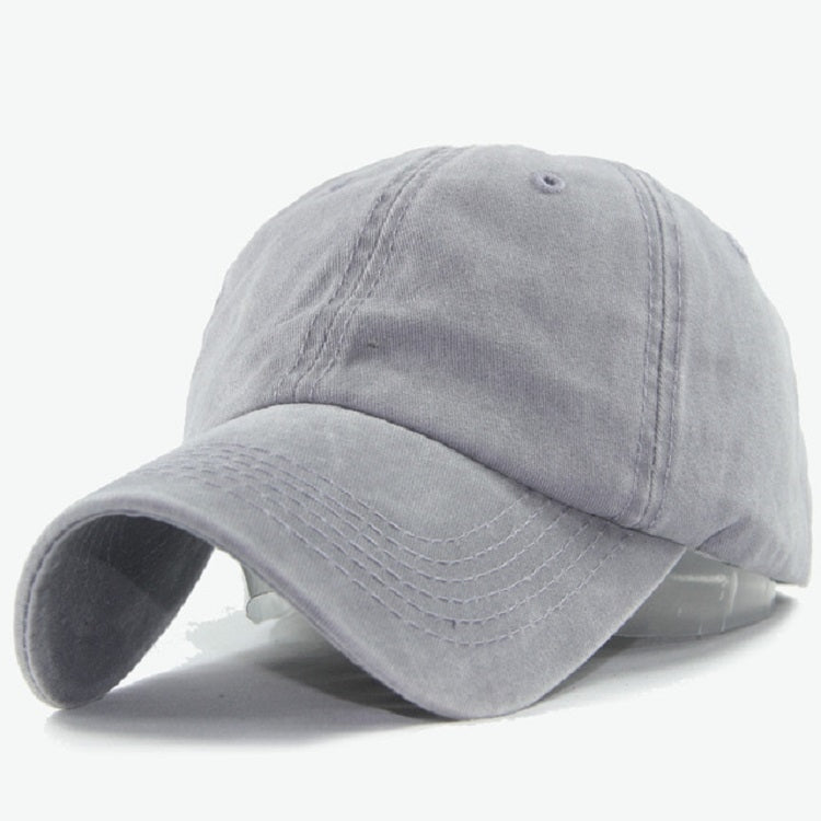 Light gray washed cotton baseball cap with curved brim and stitched front panels