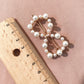 Pearl hairpin with circular cluster of white beads on gold-tone pins