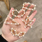 Set of pearl hair clips with gold-tone frames and white bead details
