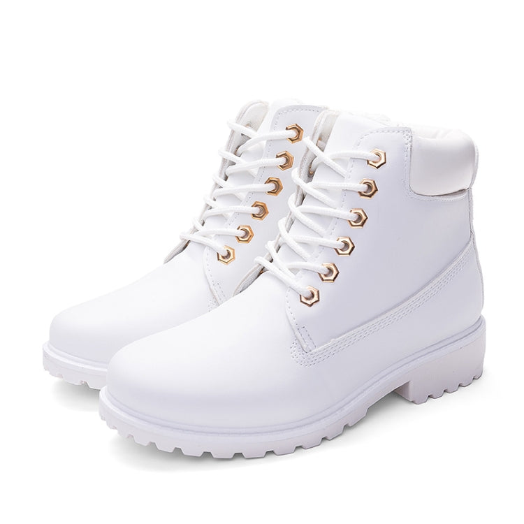 White lace-up Martin boots with thick tread sole and padded ankle collar