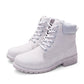 Light gray lace-up Martin boots with thick tread sole and padded ankle collar