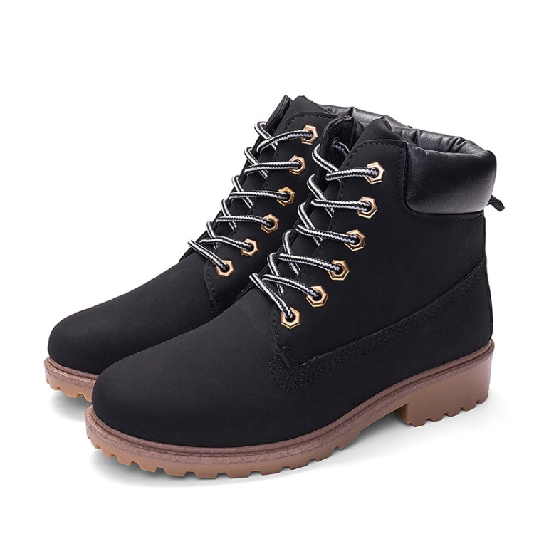 Black lace-up warm boots with padded collar, side tab, and rugged brown lug sole