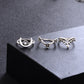 Silver-tone rings on display with sunburst, eye motif, and crescent-like cutout design