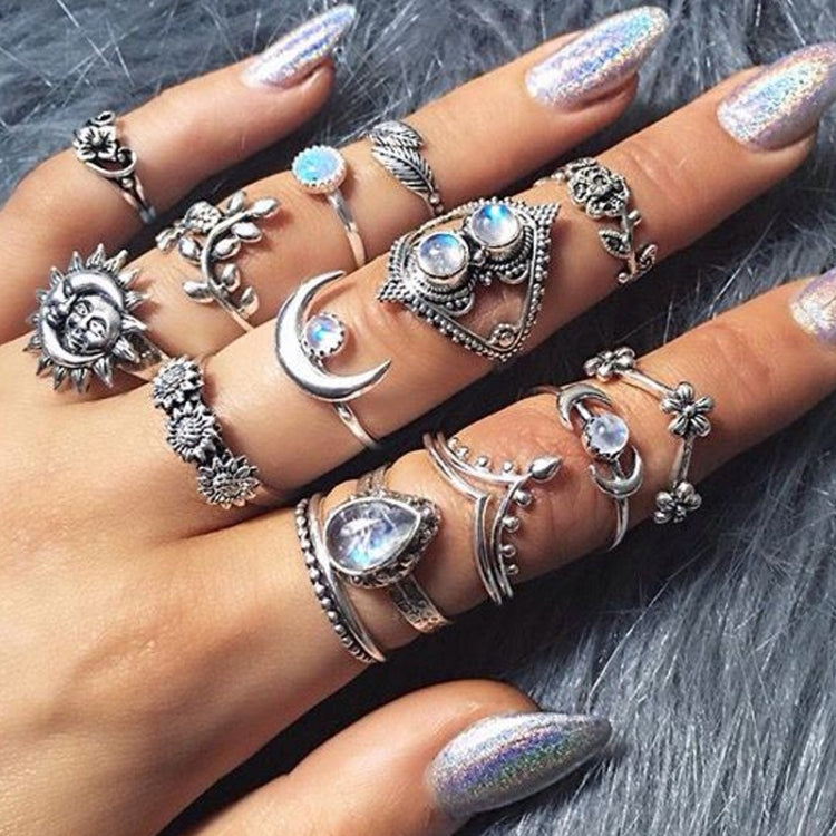 Punk vintage silver-tone ring set worn on hand with multiple moon and star designs