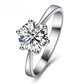 Polished silver-tone CZ engagement ring with round center stone and six ball details