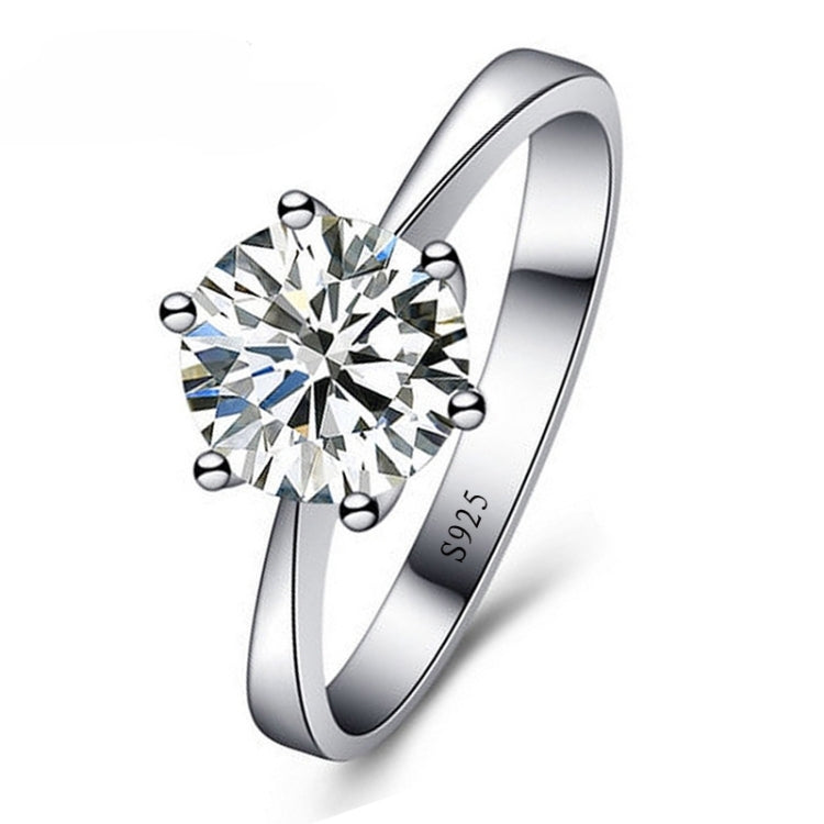 Polished silver-tone CZ engagement ring with round center stone and six ball details