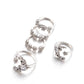 Five silver-tone adjustable rings with star/moon motifs and sparkling stones