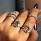 Five star and moon adjustable rings in silver tone with crystal-like stones on hand