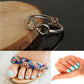 Silver metal infinity toe ring, side view on wooden edge