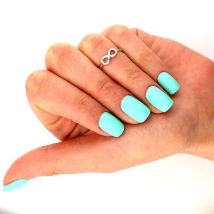 Silver infinity toe ring on hand, small loop charm and rounded band