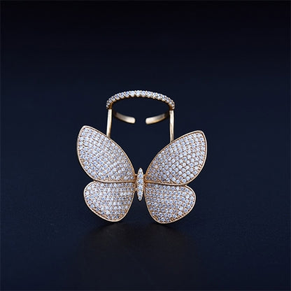 Butterfly-shaped adjustable ring with pavé stones in gold tone