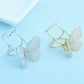 Set of two adjustable butterfly crystal rings: silver-tone and gold-tone