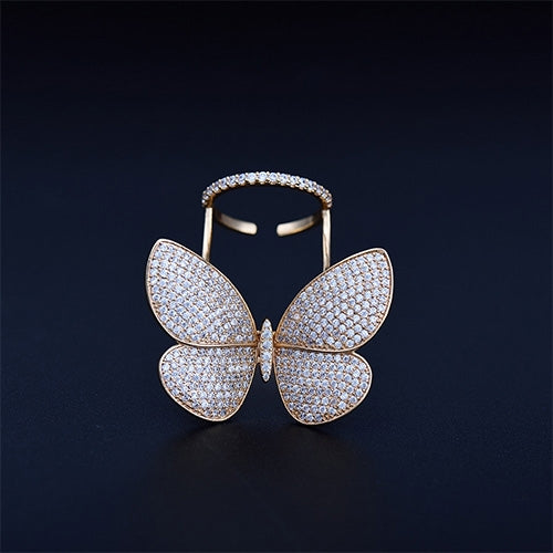Gold-tone butterfly shape ring with four sparkling crystal wings and open adjustable band