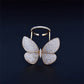 Butterfly-shaped adjustable ring with pavé stones and gold-tone band