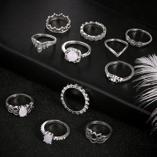 Silver-tone adjustable rings with opal-style stones, assorted ornate bands (11 pcs)