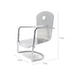 Miniature metal dollhouse chair with heart cutout backrest and open seat frame