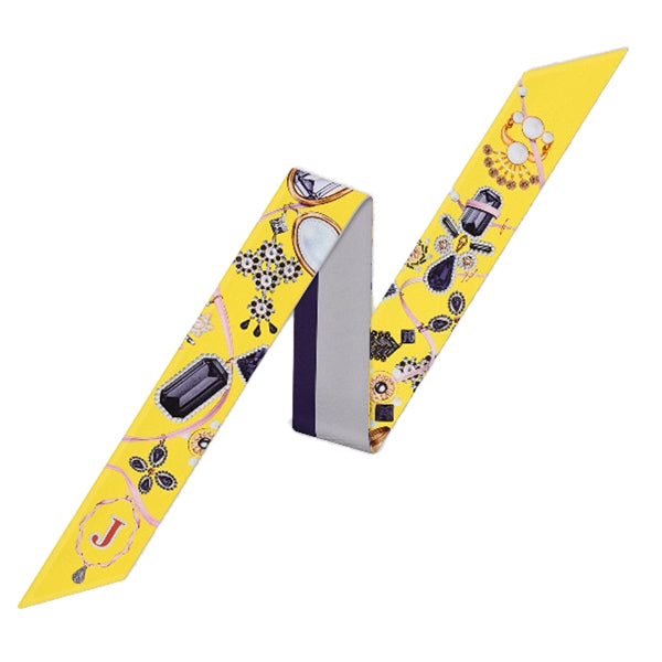 Small letter tarot scarf, yellow with ornate icons and ribbon ends, letter J