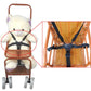 Black five-point stroller harness with chest and waist straps, shown attached.