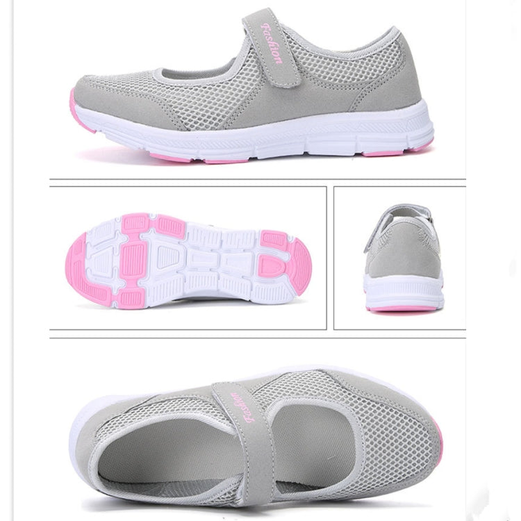 Gray mesh flat sneakers with outsole view, heel profile, and strap detail