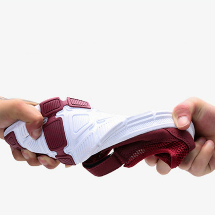 Burgundy mesh flat sneaker with white tread outsole underside view