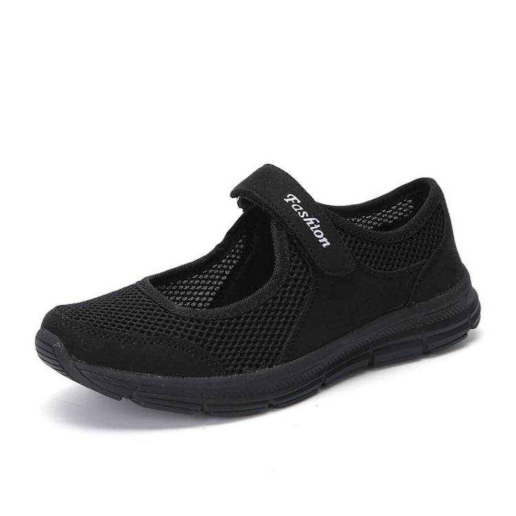 Black mesh slip-on flat sneakers with cushioned collar and dark rubber sole