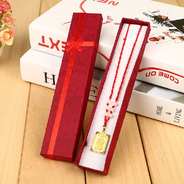 Red rectangular necklace gift box with ribbon bow, open with necklace insert