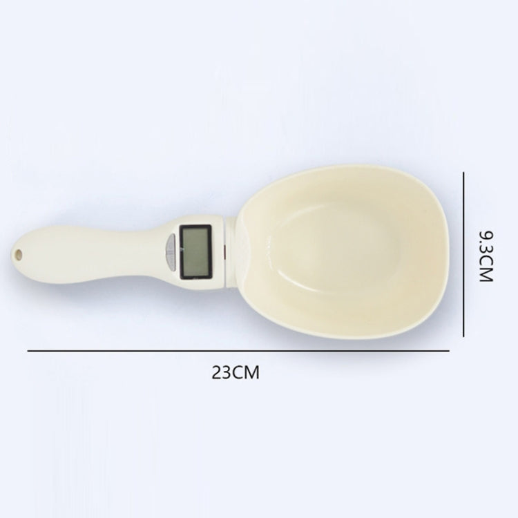 Cream electronic measuring spoon with LCD screen, shown with size markings