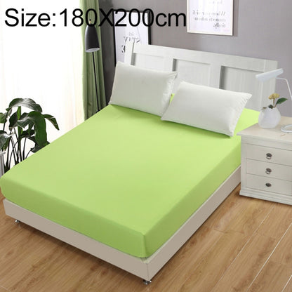 Green fitted mattress protector cover with smooth top and elasticized edges