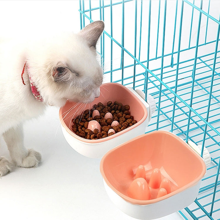 Pink plastic anti-choke hanging pet bowl with raised feeder insert and white base