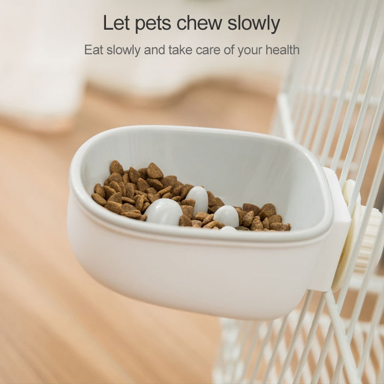 White plastic anti-choke hanging pet bowl filled with kibble, raised feeder insert