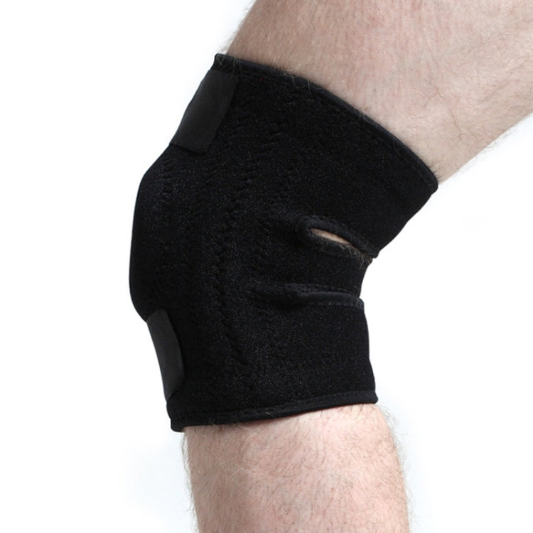 Black knee pad brace on leg with breathable fabric and adjustable strap