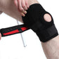 Black knee pad being adjusted on leg, showing wide support strap and padded cover