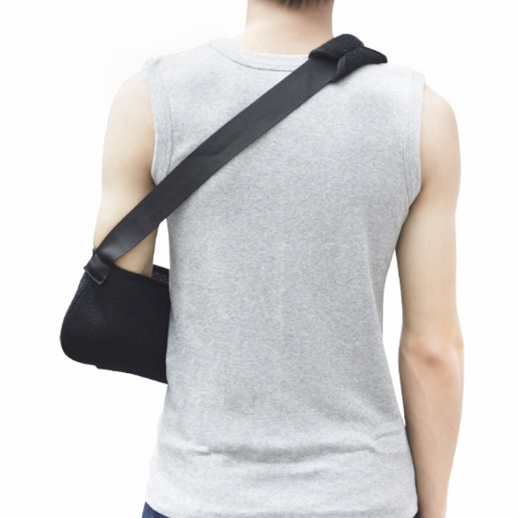 Black forearm sling worn with diagonal neck strap and padded shoulder support