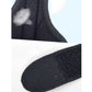 Black textured fabric wrist brace with stitched edging and thumb panel, close-up