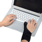 Black wrist brace worn while typing on laptop keyboard, thumb support visible
