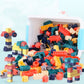 Large building blocks in a transparent blue bin with sample assembled animal and cars