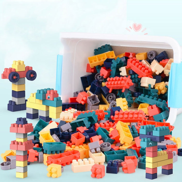 Large building blocks in a transparent blue bin with sample assembled animal and cars
