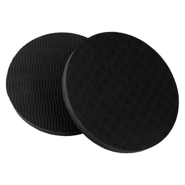 Round black yoga balance cushion, two foam discs with textured grip on top