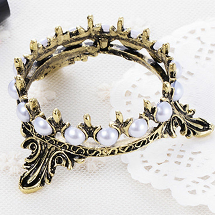 Gold-tone crown novelty pen holder with white pearl beads and ornate side details