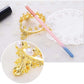 Gold-tone crown pen holder with white pearl beads, with pink and blue brush pens